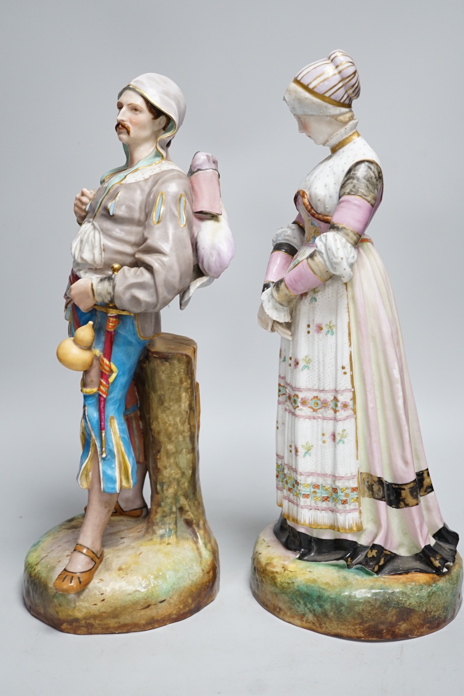 A pair of large Paris porcelain figures of a gentleman and a lady, lady 41cms high